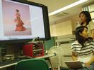 Wang and Liu showing wedding pictures